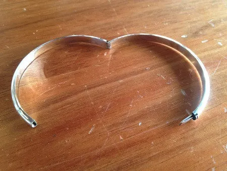 Rounded hinged silver bangle