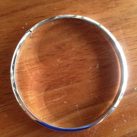 Rounded hinged silver bangle